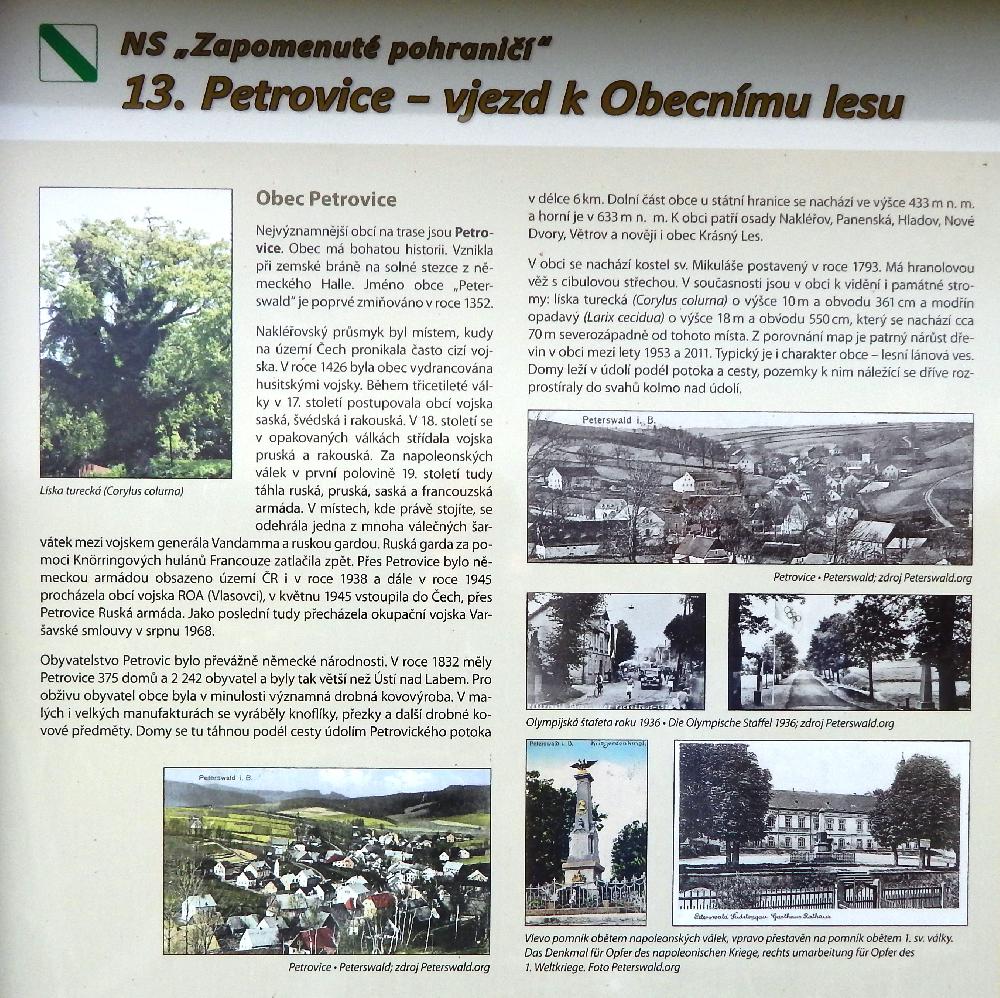 Informa�n� tabulepopisuj�c� historii obce Petrovice - Nau�n� stezka Zapomenut� pohrani��.